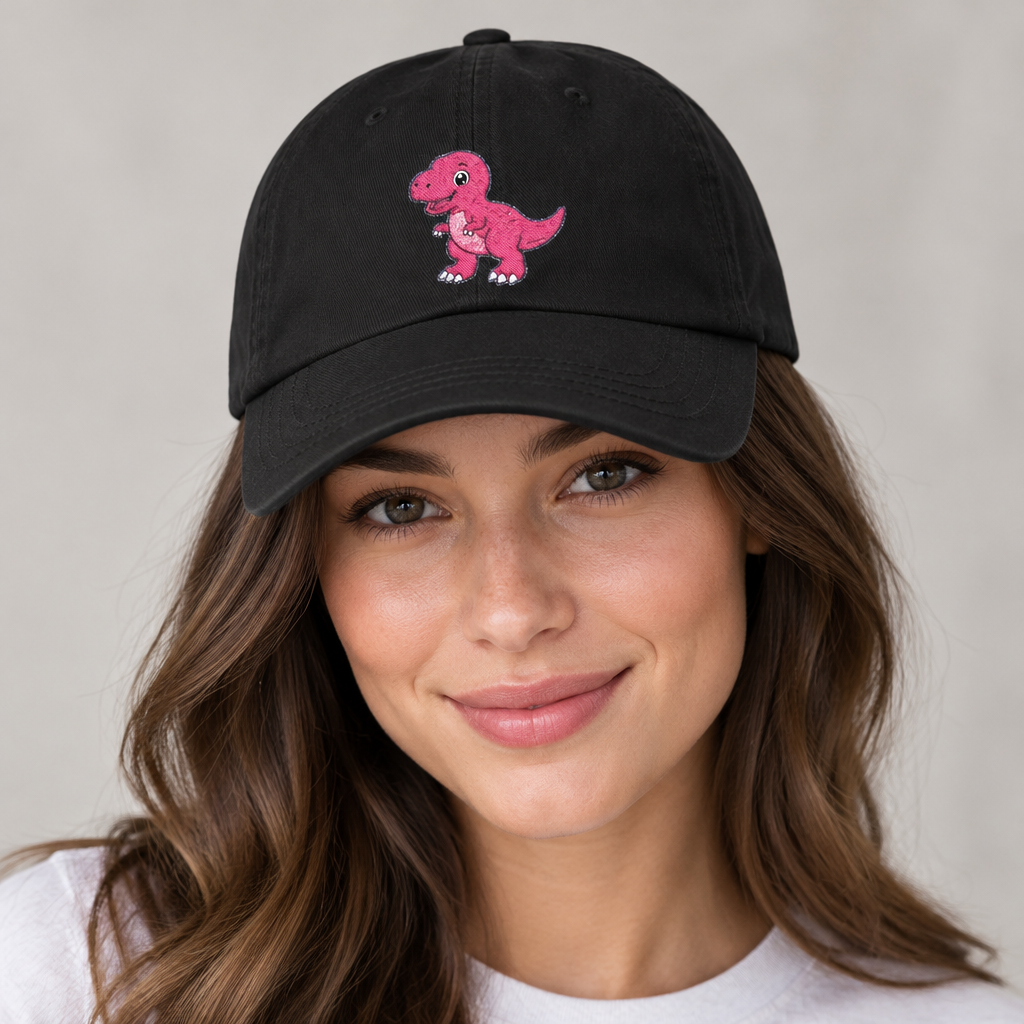 Woman wearing a black dad hat with pink baby T-Rex embroidery