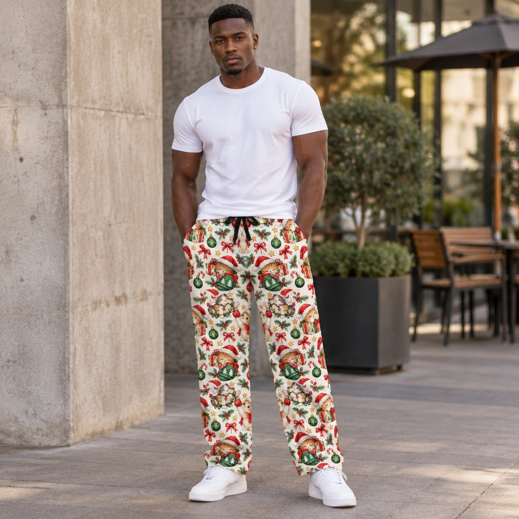 Man wearing Christmas cat print pajama pants with Santa kittens and ornaments