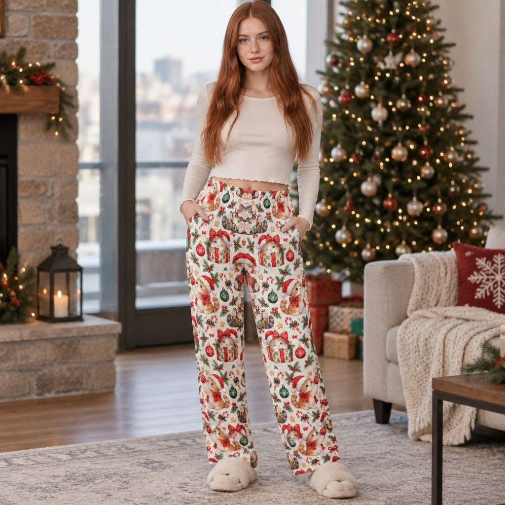 Woman wearing Christmas cat print pajama pants with Santa kittens and ornaments