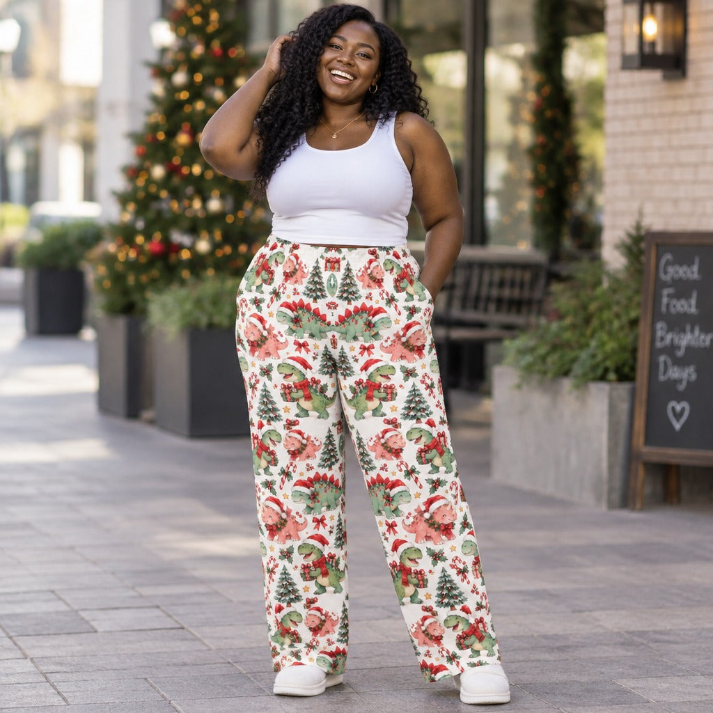 Woman wearing Christmas dinosaur print pajama pants with Santa hat dinos and trees